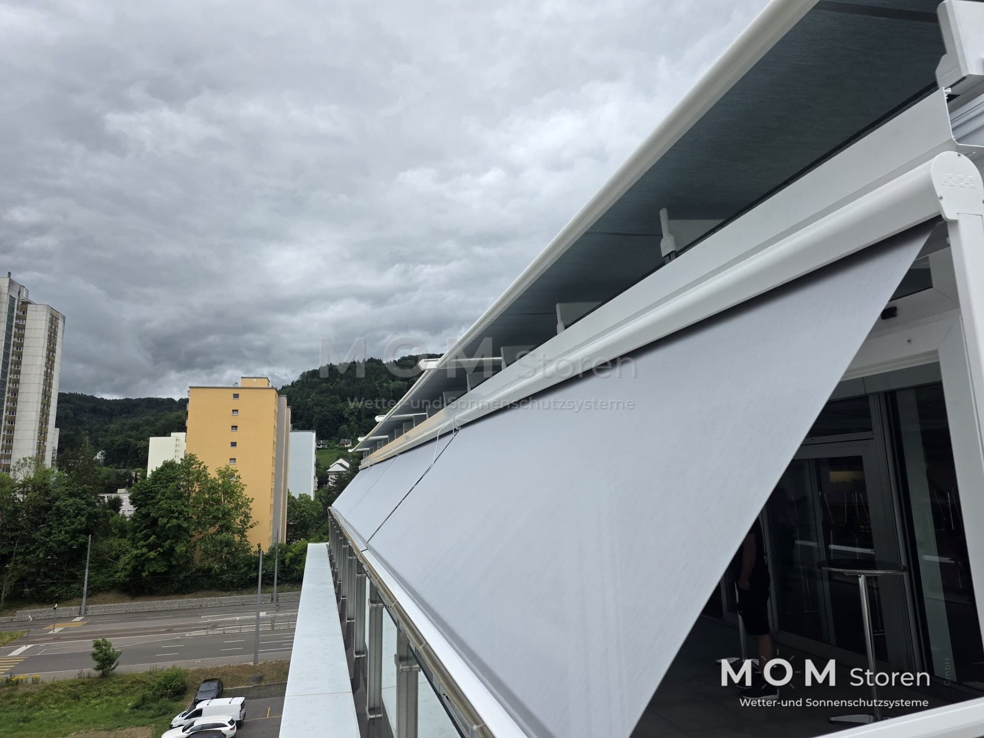 Angled view of an awning above a balcony