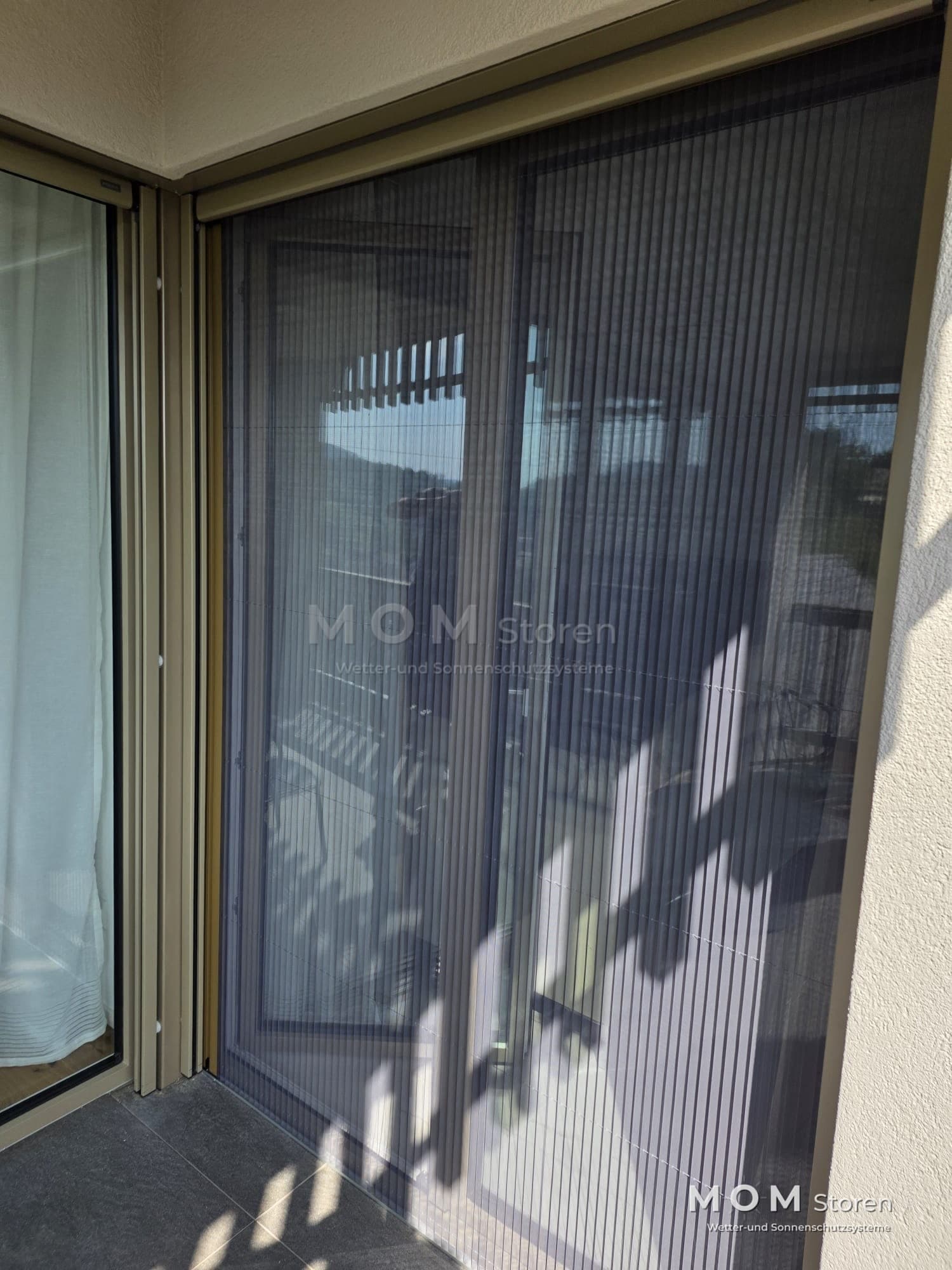 Dark mesh in front of a terrace doorway