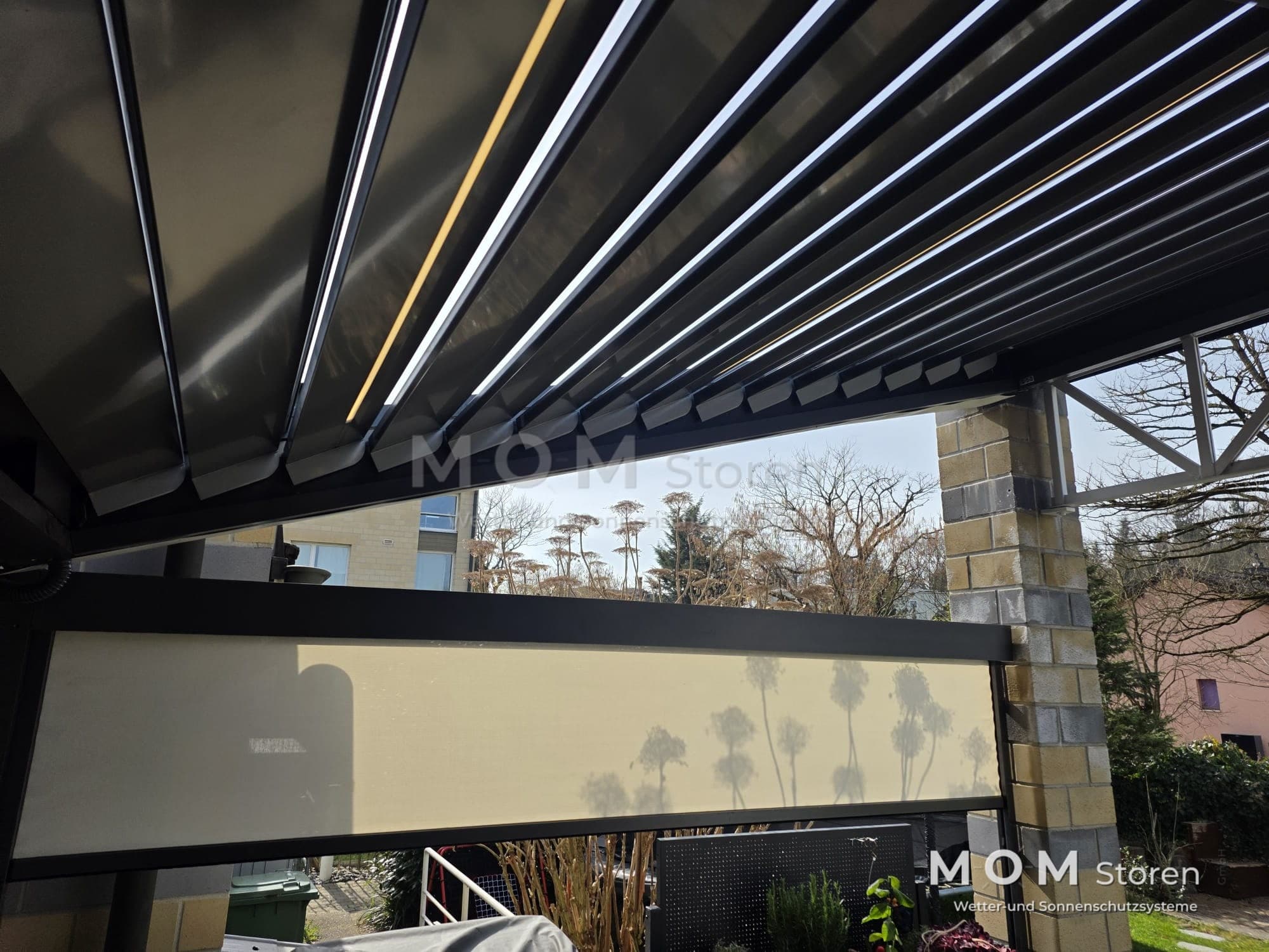 Dark louvred roof with a side valance