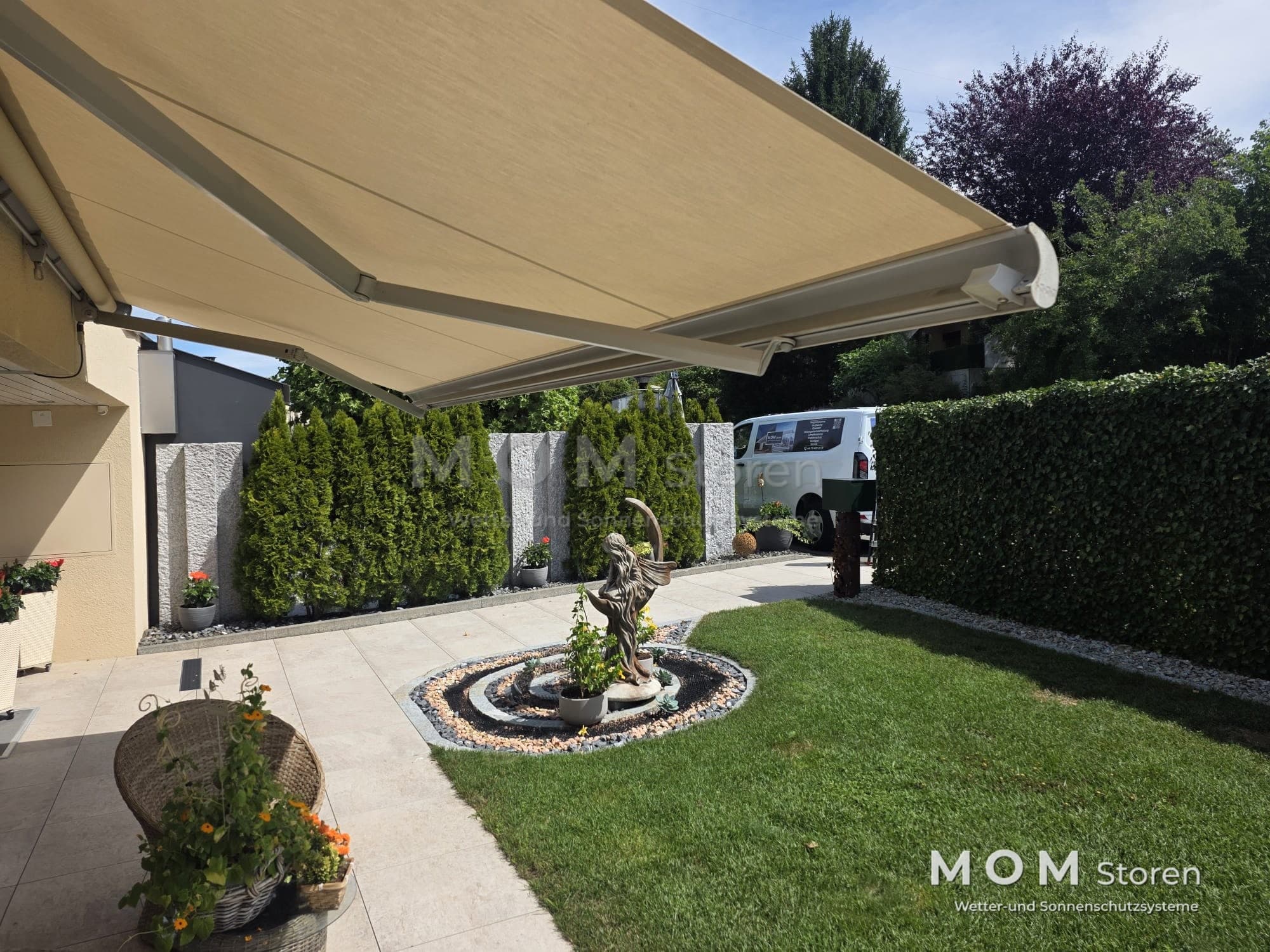 Beige awning beside a garden façade