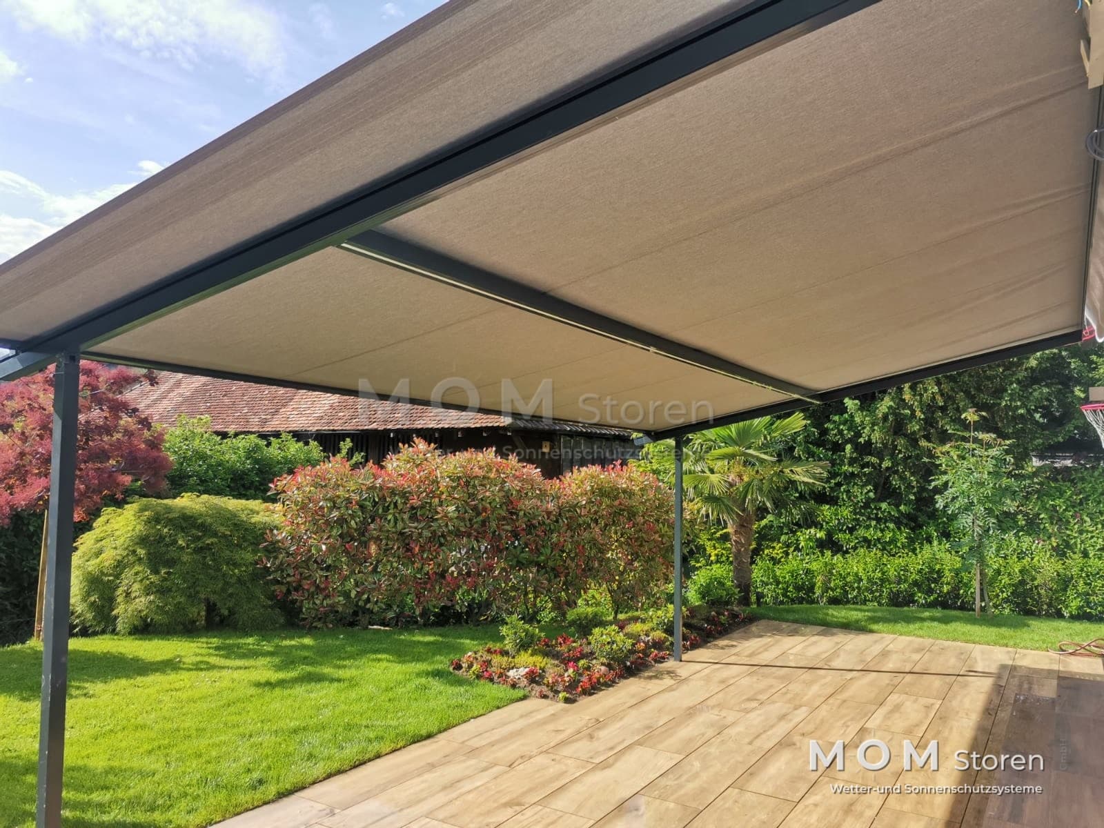 Beige pergola awning above timber decking