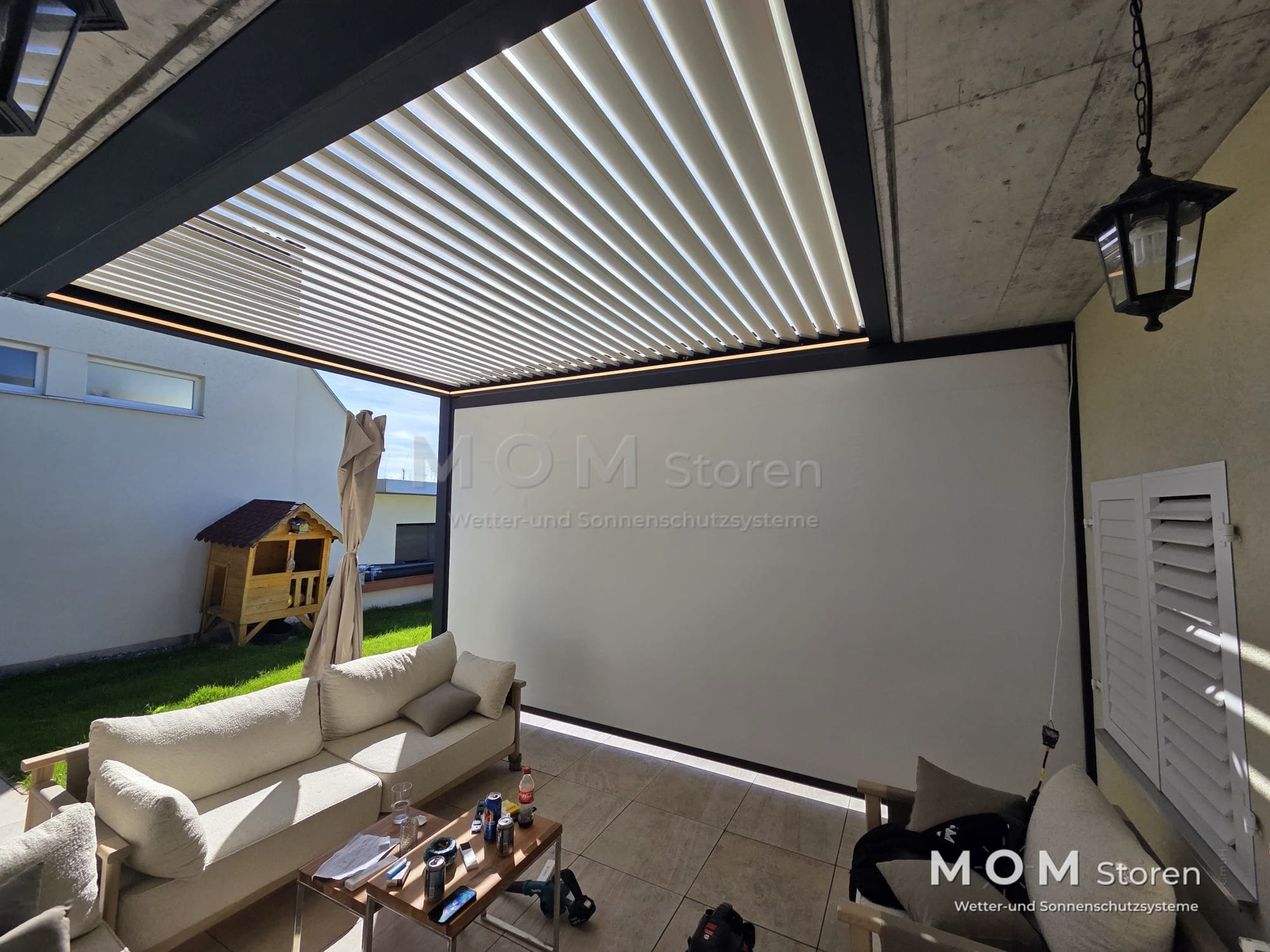 White louvred roof over garden seating